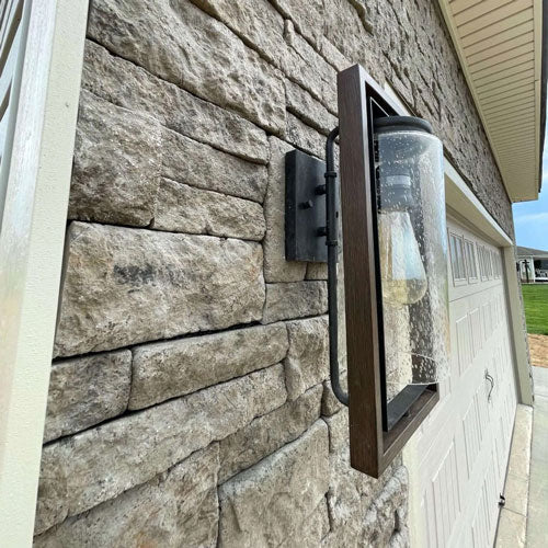 Evolve Stone Morning Aspen on front of house garage with light sconce grey color
