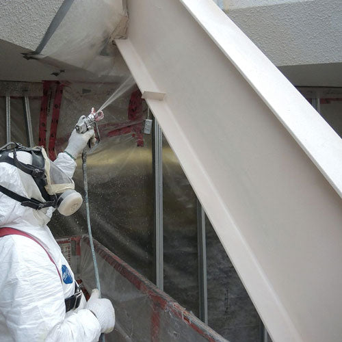 man applying Carbocrylic 3359 topcoat finish in white to a building exterior