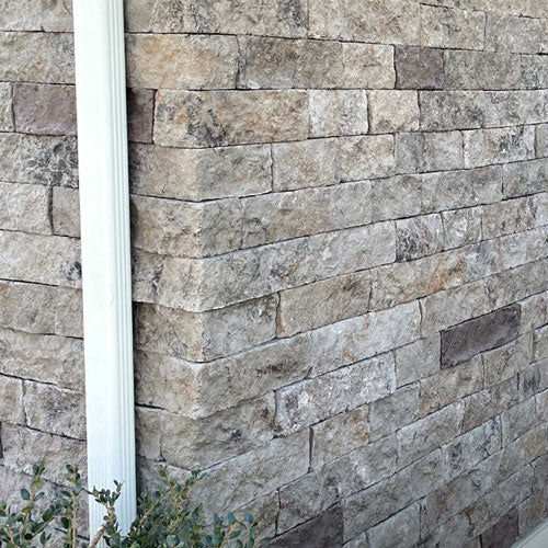Evolve Stone Mortarless Siding River Clay color corners on exterior house