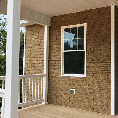 Stone veneer siding on front of house Evolve Stone District View style Dune Point Color