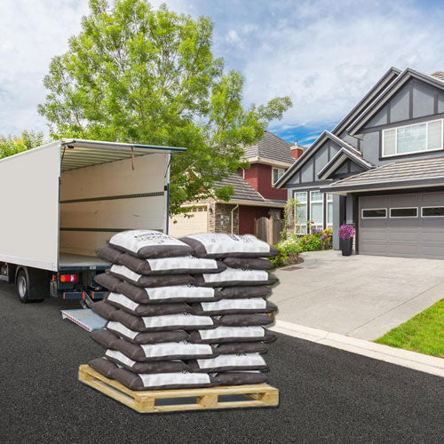 brown rubber mulch on pallet delivered by truck to residential home
