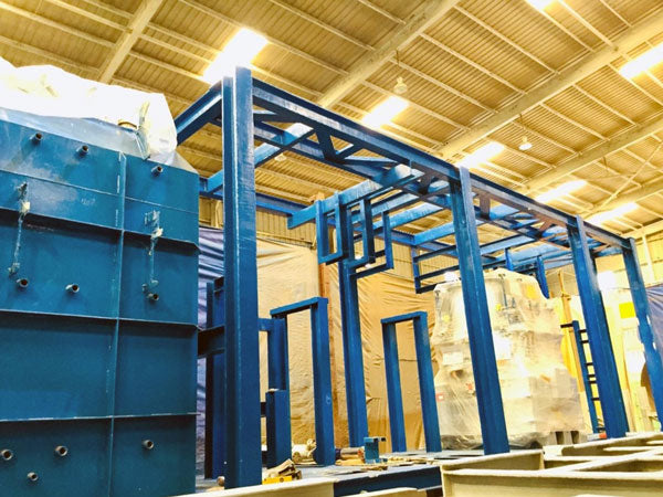 Carbothane 133 HB high build polyurethane coating on industrial machinery. carboline blue color