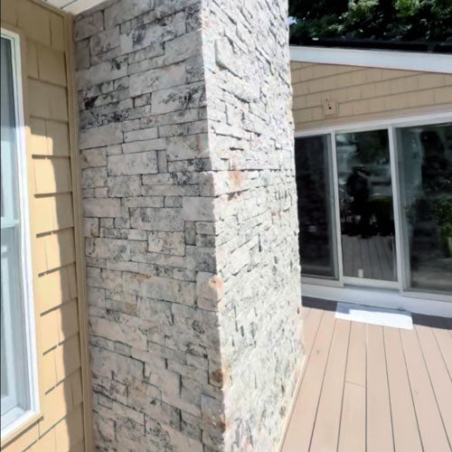 Evolve Stone Veneer Siding River Clay color in Capital Sky style pattern on house chimney