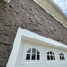 stone veneer siding around garage dark color evolve stone kodiak mine color