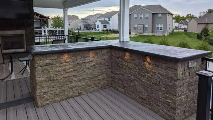Outdoor living space with stone siding morning aspen stone veneer