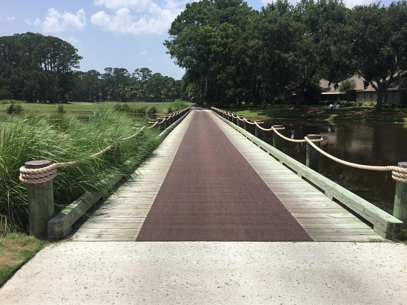 brown high traffic non-slip matting on golf course walkway