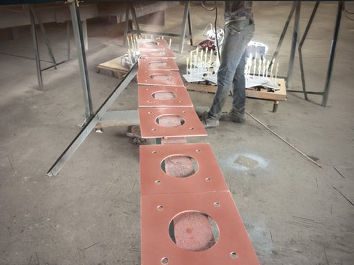 Carboweld 11 being spray applied to steel plates 