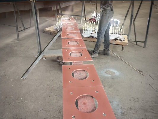 Carboweld 11 being spray applied to steel plates 
