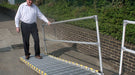 man walking on roll a ramp portable wheelchair ramp