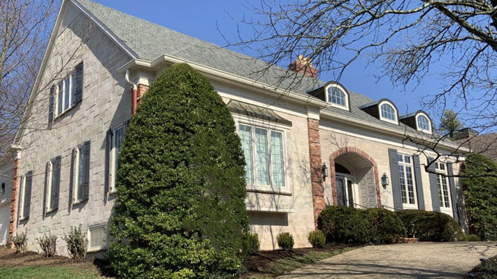 White Mortarless Stone Siding Panels on house exterior Carved Block Sea Salt Color