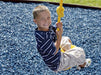 Kid playing in Blue Rubber Mulch