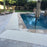 VInyl mesh pool mat laying on stone pool deck sandstone color