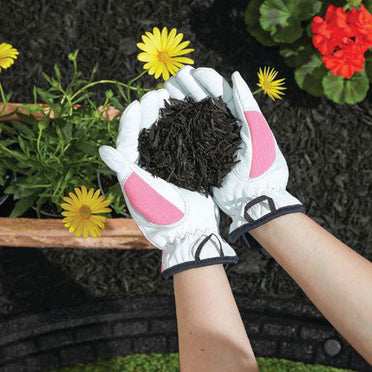 Black Shredded rubber mulch in landscape with flowers